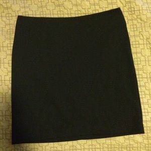 Black form fitting skirt.